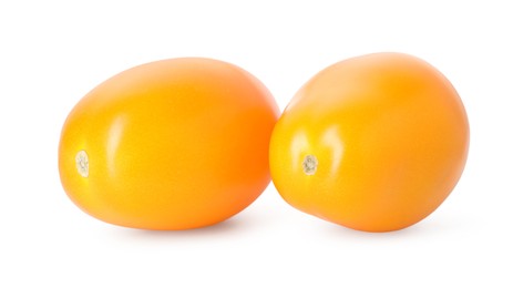 Photo of Two ripe yellow tomatoes isolated on white