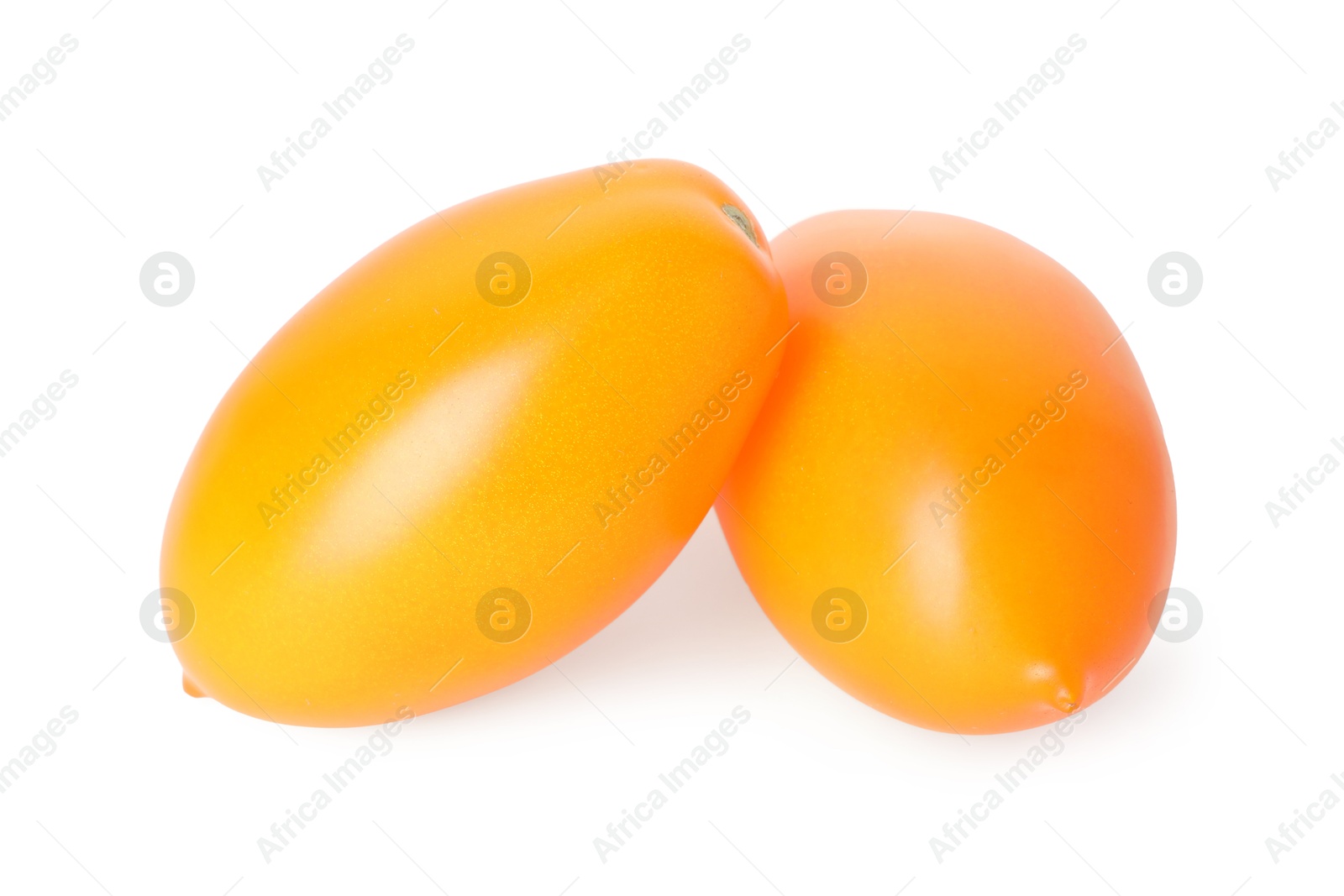 Two ripe yellow tomatoes isolated on white Photo of Two ripe yellow tomatoes isolated on white