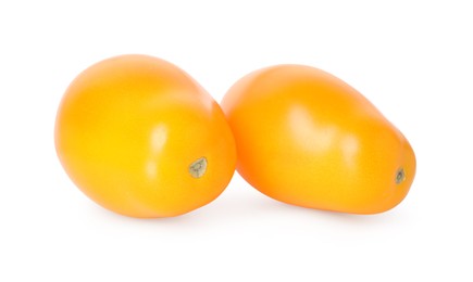 Photo of Two ripe yellow tomatoes isolated on white