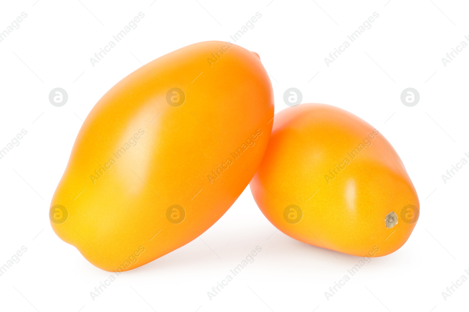 Photo of Two ripe yellow tomatoes isolated on white