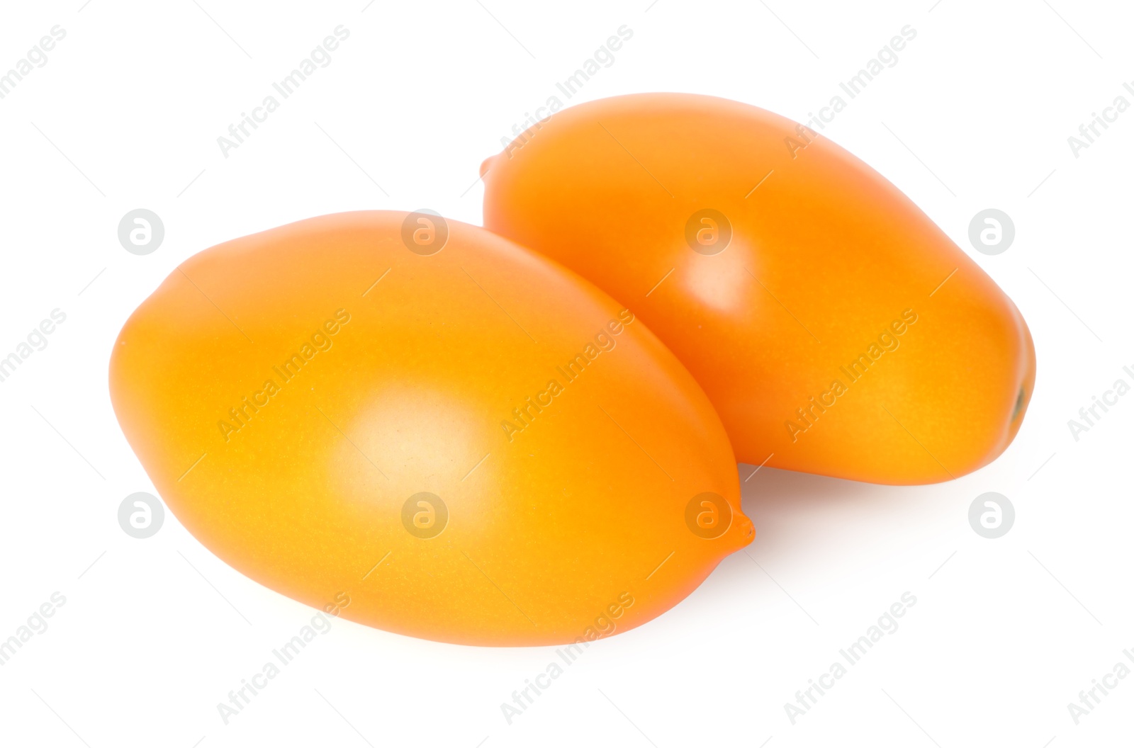 Two ripe yellow tomatoes isolated on white Photo of Two ripe yellow tomatoes isolated on white
