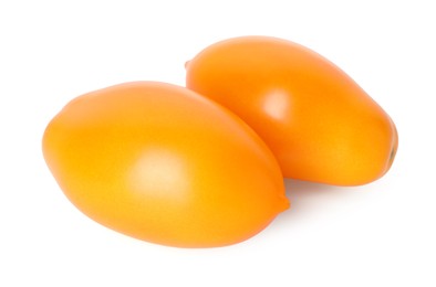 Photo of Two ripe yellow tomatoes isolated on white