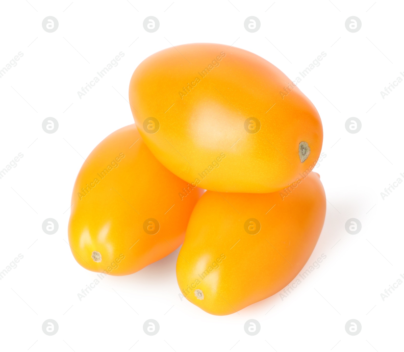 Many ripe yellow tomatoes isolated on white Photo of Many ripe yellow tomatoes isolated on white