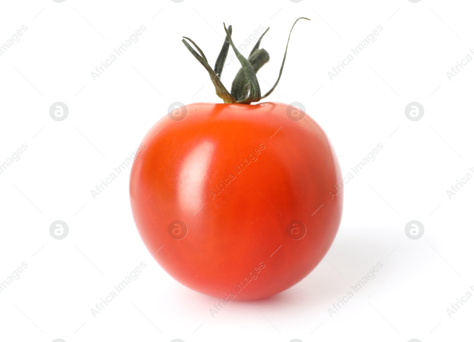 One ripe cherry tomato isolated on white Photo of One ripe cherry tomato isolated on white