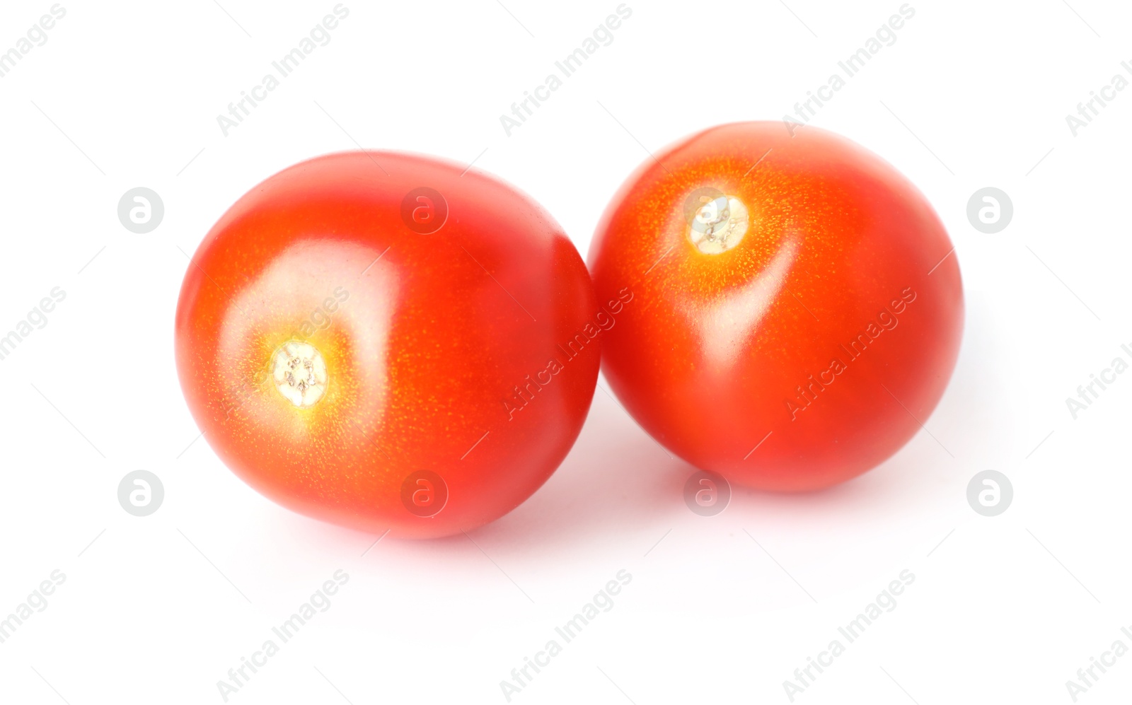 Two ripe cherry tomatoes isolated on white Photo of Two ripe cherry tomatoes isolated on white