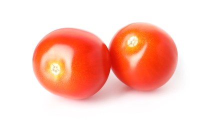 Photo of Two ripe cherry tomatoes isolated on white
