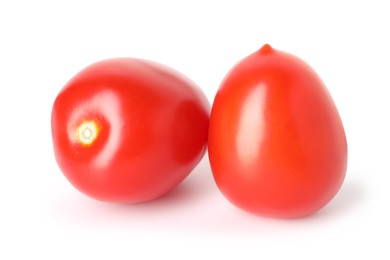 Photo of Two ripe red tomatoes isolated on white