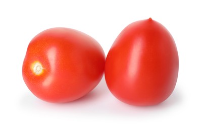 Photo of Two ripe red tomatoes isolated on white