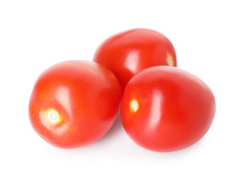 Photo of Many ripe red tomatoes isolated on white