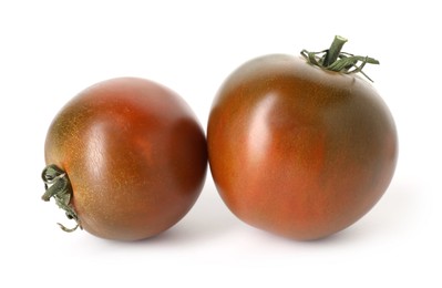 Photo of Two ripe brown tomatoes isolated on white