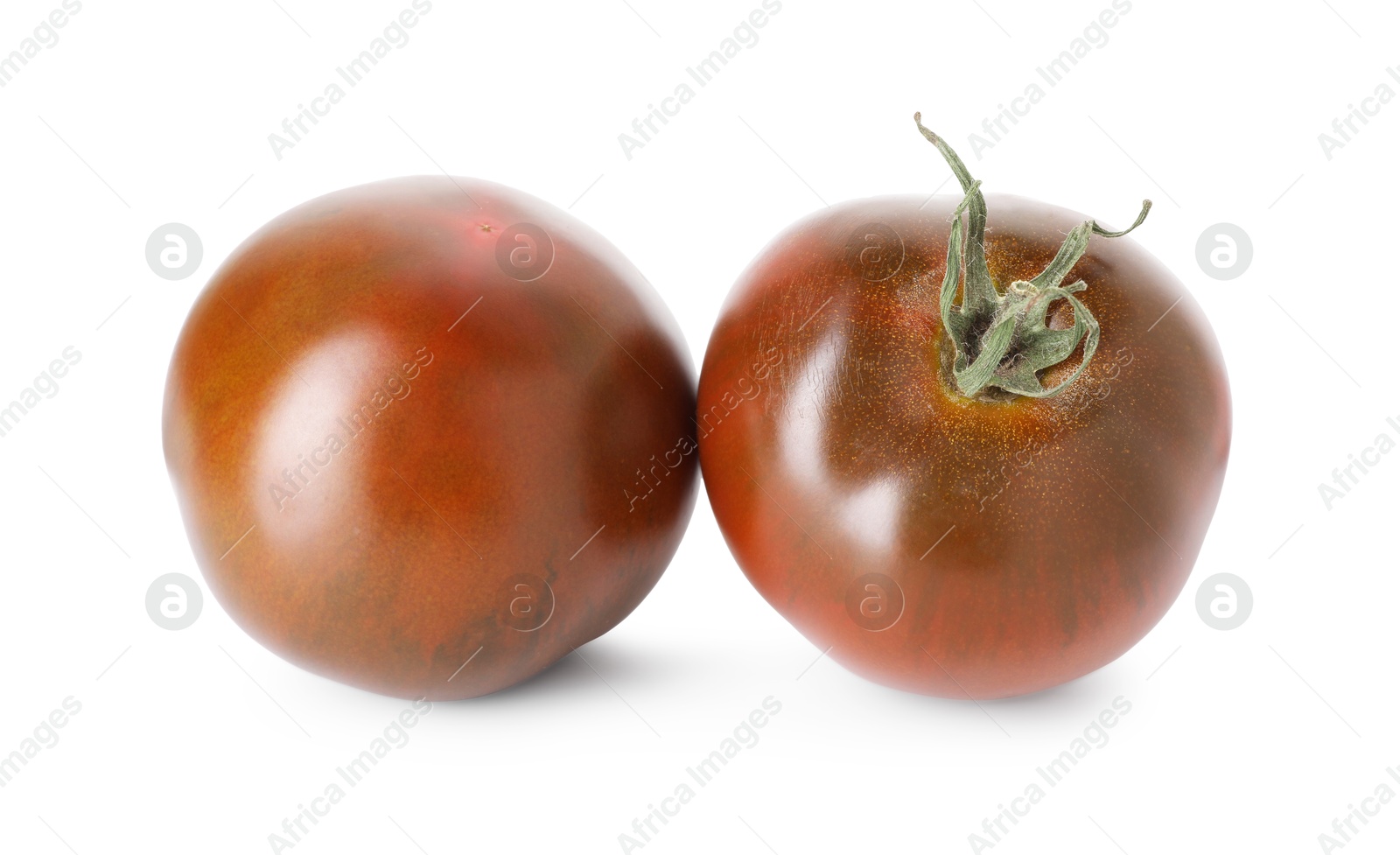 Photo of Two ripe brown tomatoes isolated on white