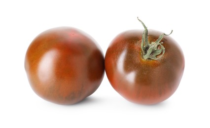 Photo of Two ripe brown tomatoes isolated on white