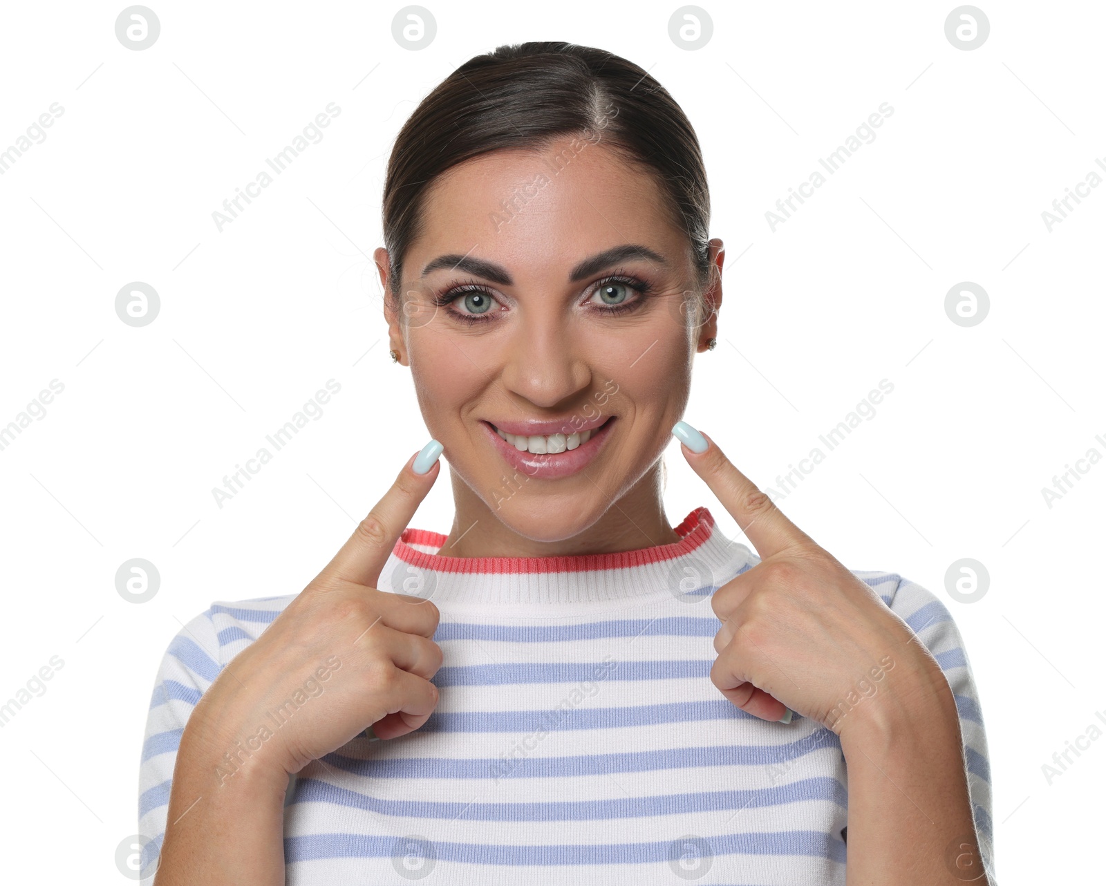 Photo of Woman pointing at her healthy teeth on white background