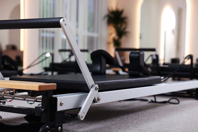 Photo of Reformer machines in studio, closeup. Pilates equipment