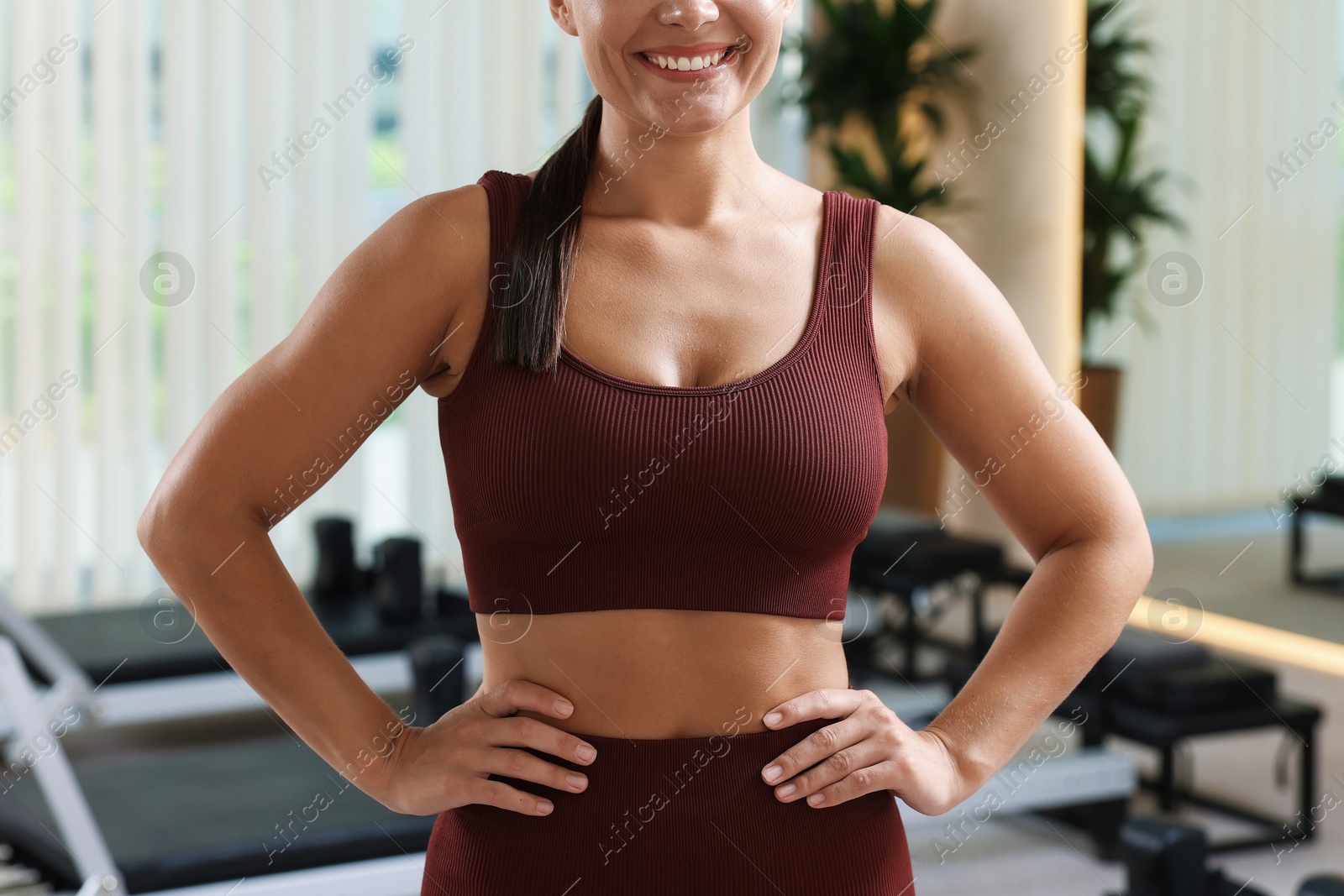 Photo of Woman wearing sportswear in pilates studio, closeup