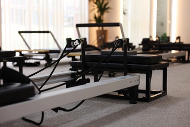 Photo of Reformer machines in studio, closeup. Pilates equipment