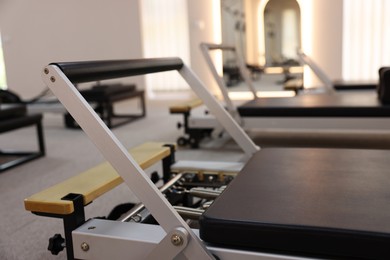 Photo of Reformer machines in studio, closeup. Pilates equipment