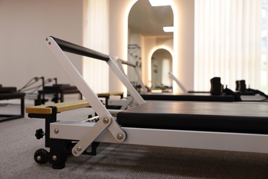 Photo of Reformer machines in studio, closeup. Pilates equipment