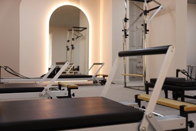 Photo of Reformer machines in studio, closeup. Pilates equipment