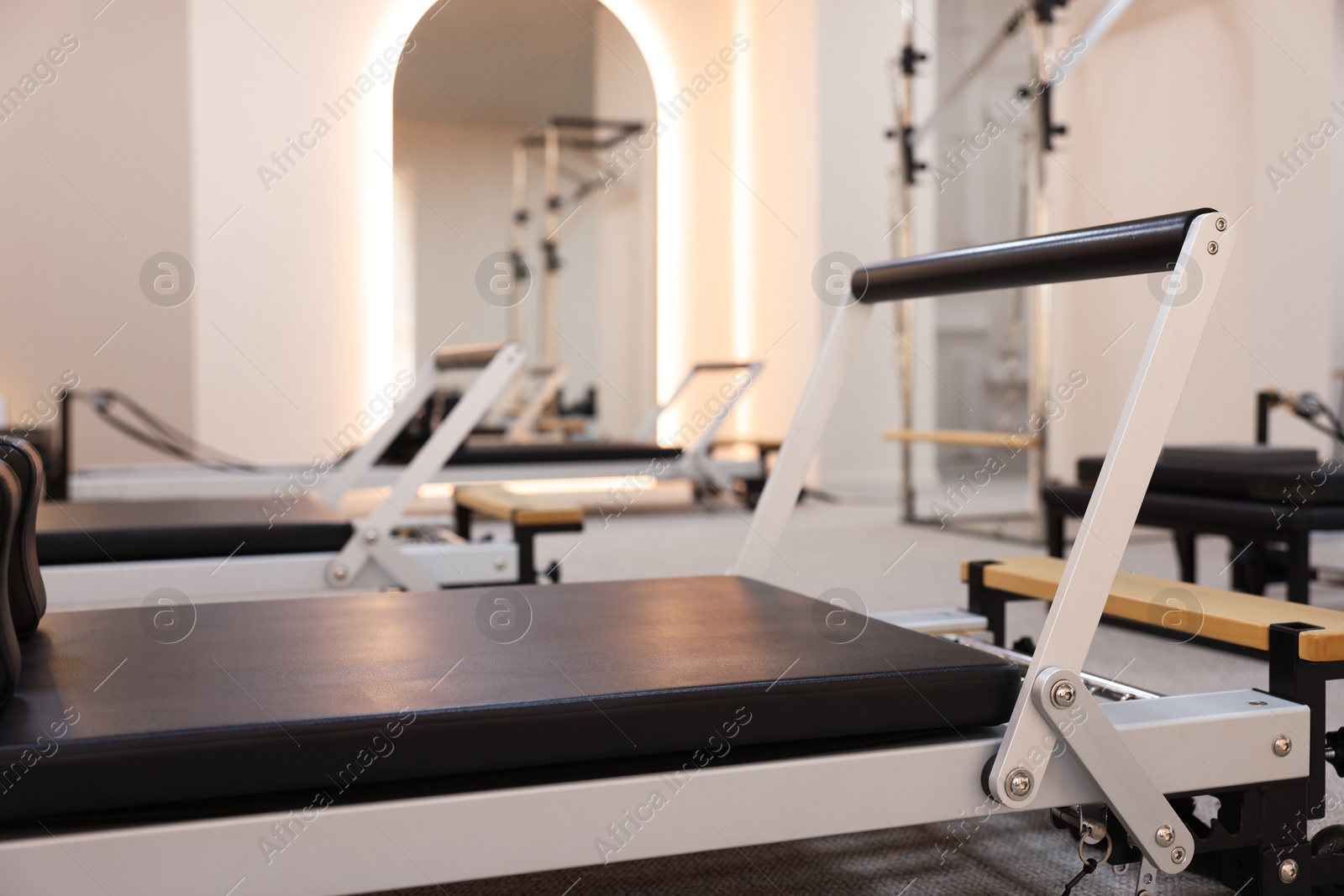 Reformer machines in studio, closeup. Pilates equipment Photo of Reformer machines in studio, closeup. Pilates equipment