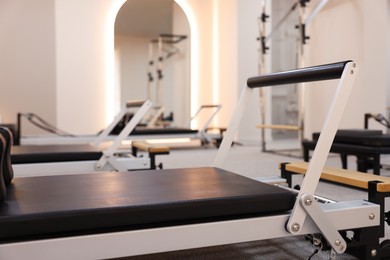 Photo of Reformer machines in studio, closeup. Pilates equipment