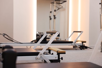 Photo of Reformer machines in studio, closeup. Pilates equipment