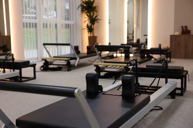 Photo of Reformer machines in studio, closeup. Pilates equipment