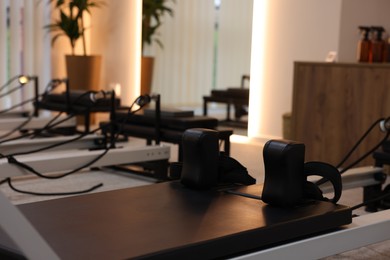 Photo of Reformer machines in studio, closeup. Pilates equipment