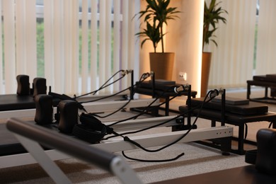 Photo of Reformer machines in studio, closeup. Pilates equipment