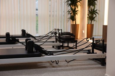 Photo of Reformer machines in studio, closeup. Pilates equipment
