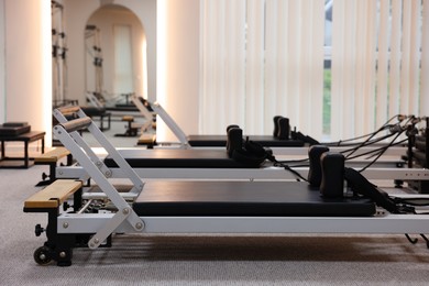 Photo of Reformer machines in studio, closeup. Pilates equipment