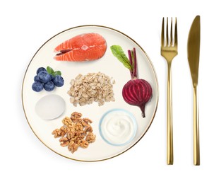 Image of Plate with collection of different foods and cutlery on white background, top view. Healthy eating