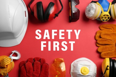 Image of Safety first, poster. Personal protective equipment on red background, top view