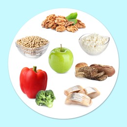 Image of Healthy plate with collection of different foods on light blue background, top view