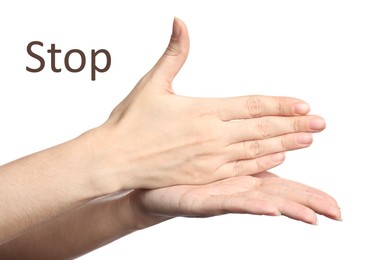 Image of Woman showing word Stop on white background, closeup. Sign language