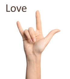 Image of Woman showing word Love on white background, closeup. Sign language