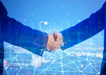 Image of Business partners shaking hands against cityscape, multiple exposure. Deal, agreement, partnership, success