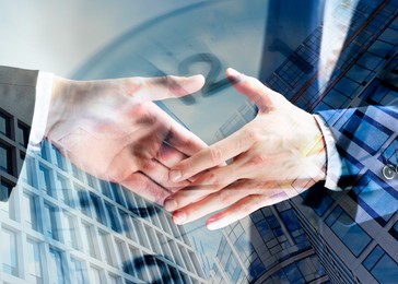 Image of Business partners shaking hands against office buildings, multiple exposure with clock. Deal, agreement, partnership, success