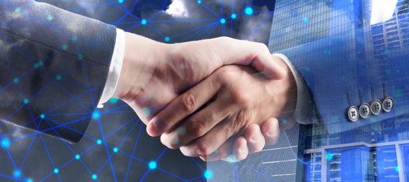 Image of Business partners shaking hands against office buildings, double exposure. Deal, agreement, partnership, success