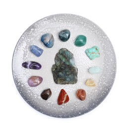Photo of Many different healing stones isolated on white, top view