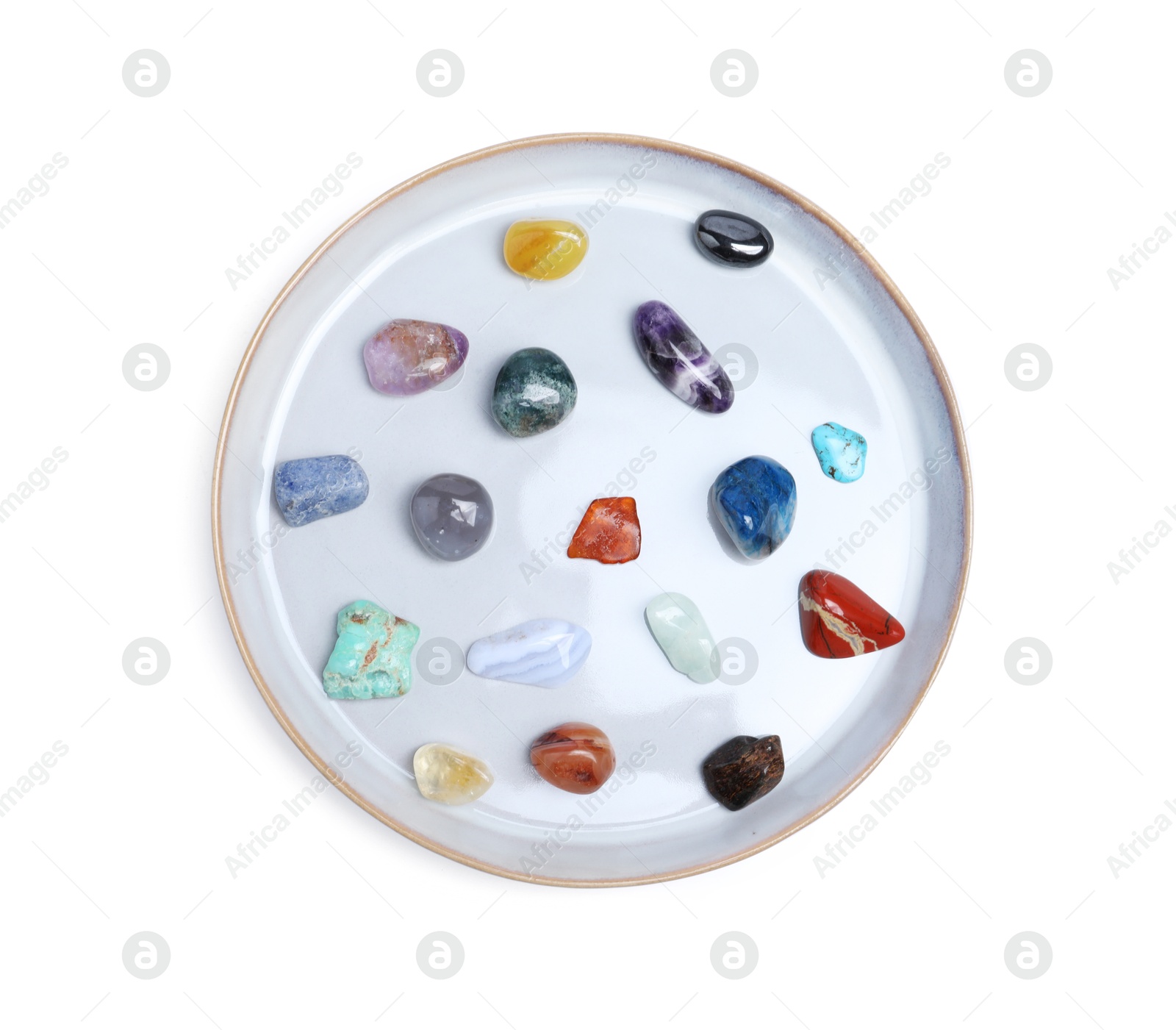 Photo of Many different healing stones isolated on white, top view