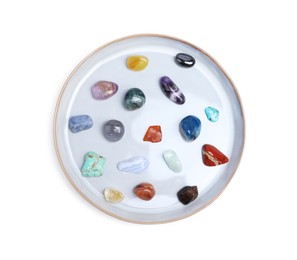 Photo of Many different healing stones isolated on white, top view