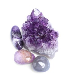 Photo of Many different healing stones isolated on white, top view