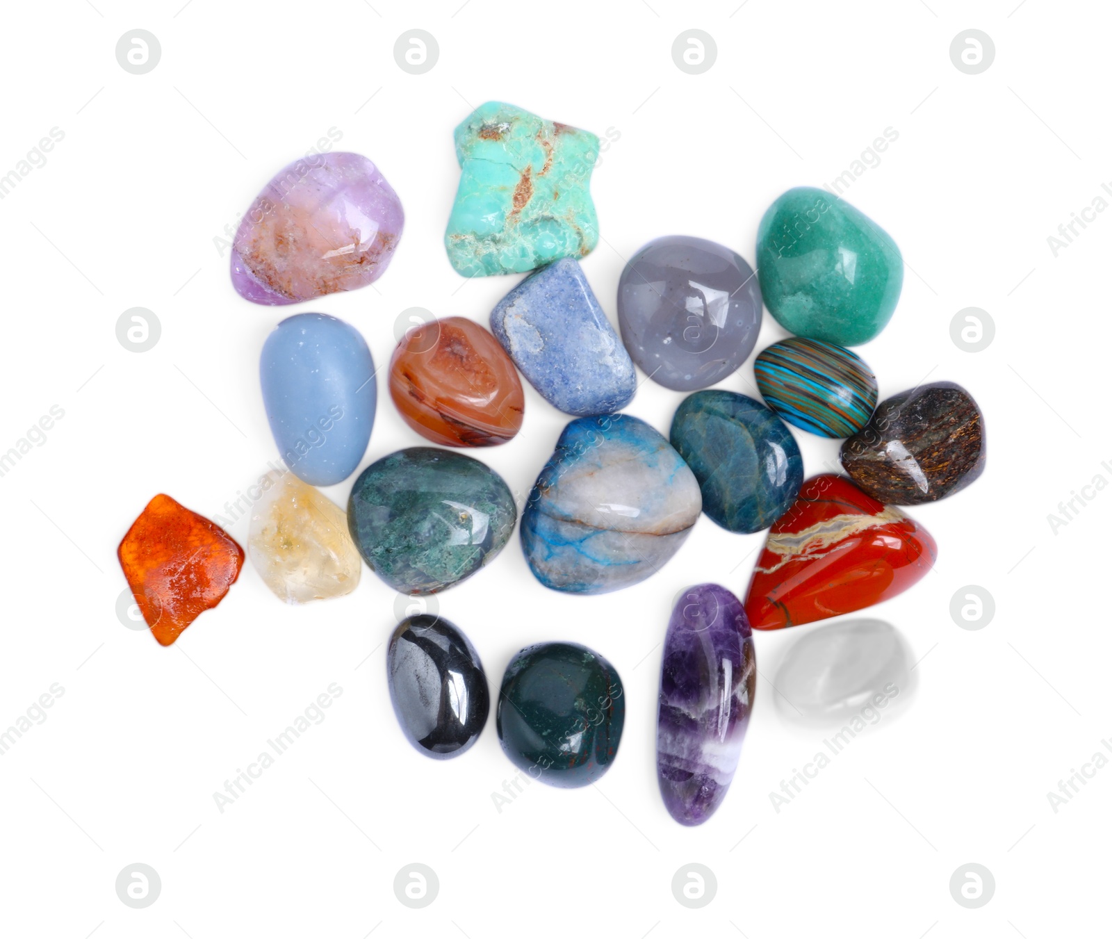 Photo of Many different healing stones isolated on white, top view