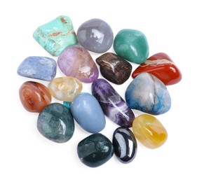 Photo of Many different healing stones isolated on white, top view