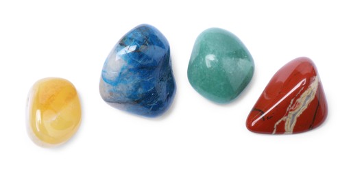 Photo of Many different healing stones isolated on white, top view