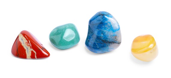 Photo of Many different healing stones isolated on white, top view