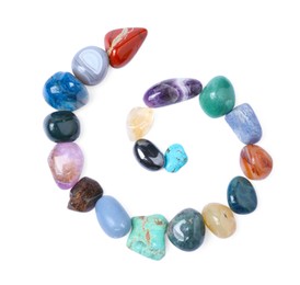 Photo of Many different healing stones isolated on white, top view