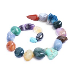 Photo of Many different healing stones isolated on white