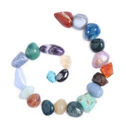 Photo of Many different healing stones isolated on white, top view